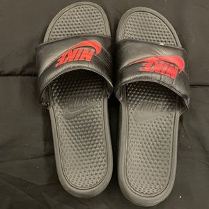 Black and red Nike slides